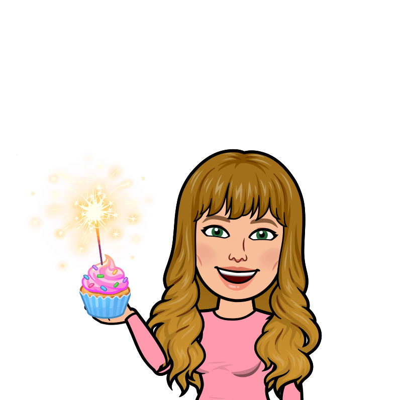 Shanna holding a cupcake with a sparkler